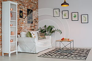 Living room with brick wall