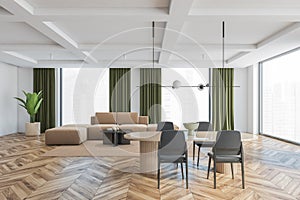 Living room with brown and grey furniture, chairs and sofa and big windows