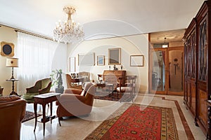 Living room, classic interior with antiquities photo