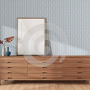 Living room close-up with frame mockup in white and blue tones. Wooden chest of drawers and japandi wallpaper. Farmhouse interior