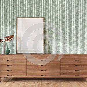 Living room close-up with frame mockup in white and green tones. Wooden chest of drawers and japandi wallpaper. Farmhouse interior