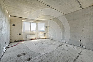 Living room with concrete walls, floor and ceiling, no plaster
