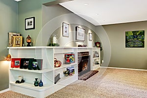 Living room corner with fireplace and decorated shelves
