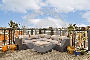 a living room with a couch on a deck with