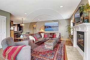 Living room with cozy fireplace and leather couch