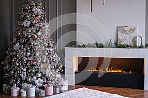 Living room with decorated Christmas tree, gifts and fireplace