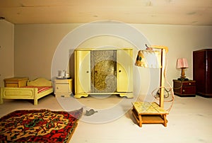 Living room in a dollhouse with lamp and retro wardrobe
