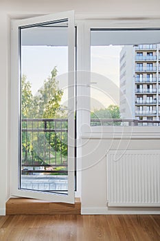 Living room with double glazed window and balcony door
