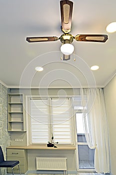 Living room with fan chandelier on the ceiling