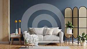 Living room with gray sofa and dark blue wall