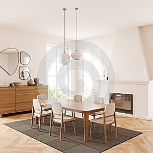 Living room interior with chairs and fireplace, commode and panoramic window