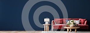 Living room interior mock-up with red sofa, wooden table and rattan home decoration in dark blue background