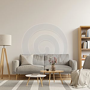 Living room interior with sofa, coffee tables, floor lamp and books on the shelves. Bright interior with large, empty mockup wall.