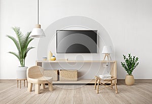Living room interior with TV stand,chair,lamp,pot and plant on white wall background.Minimal style.