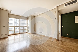 living room with large window, ducted air conditioning photo