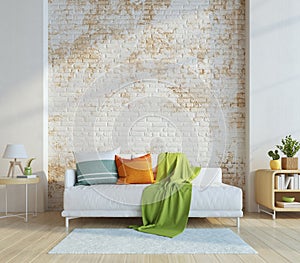 Living room in modern style with white sofa and colourful pillows and old brick wall background.