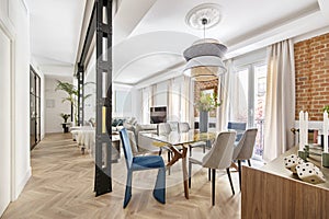 Living room with oak herringbone wall flooring, decorative glass