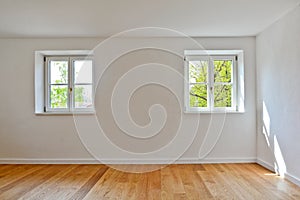 Living room in an old building - Apartment with wooden windows and parquet flooring after renovation