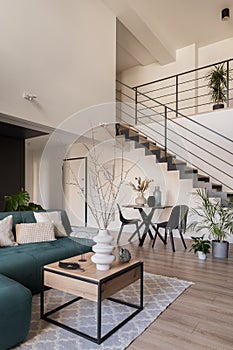 Living room with table and stairs