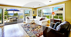 Living room with walkout deck and bay view. Tacoma real estate, photo