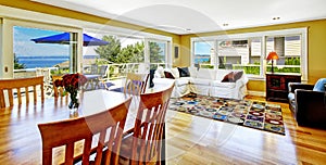 Living room with walkout deck and bay view. Tacoma real estate,