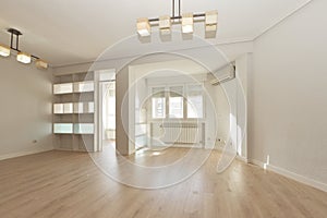 Living room with white work shelving, aluminum radiators