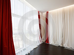 Living room window with red curtains