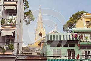 Living in Saigon: picturesque balconies of residential houses and Cha Tam Church