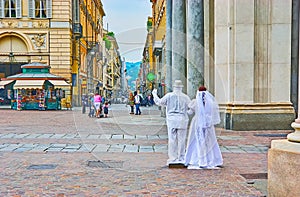The living statue of bride and groom in Piazza San Carlo Square, Turin, Italy photo