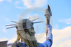 Living Statue of Liberty. USA holiday concept. Background with selective focus and copy space