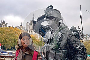 Living statue of a soldier on London`s waterfront