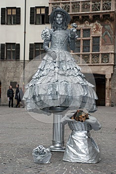 Living statue of woman with flower