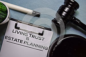 Living trust and Estate Planning text on Document form and Gavel  on office desk.