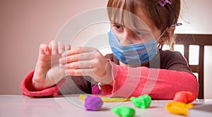 Living under coronavirus quarantine: game and occupation for child at home during quarantine of coronavirus. Ð¡ute little girl