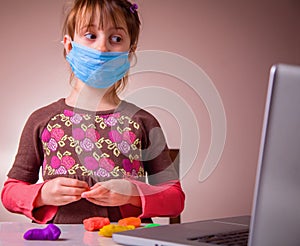 Living under coronavirus quarantine: game and occupation for child at home during quarantine of coronavirus. Young girl with