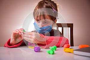 Living under coronavirus quarantine: game and occupation for child at home during quarantine of coronavirus. Young girl with