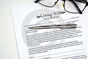 Living will declaration form with glasses