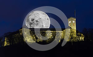 Ljubljana castle with full moon photo