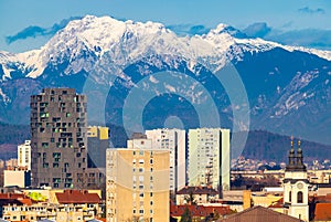 Ljubljana, Slovenia: High-rise modern residential buildings and the snowy Alps