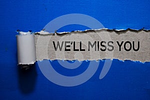 We`ll Miss You Text written in torn paper photo