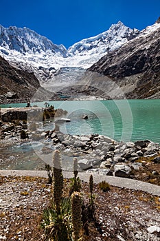 Llaca lagoon in the peruvian Andes and Ocshapalpa peak and Ranrapalca peak photo