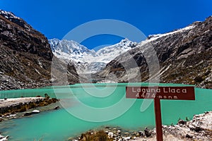 Llaca lagoon in the peruvian Andes and Ocshapalpa peak and Ranrapalca peak photo