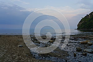 Llanbedrog beach at low tide on a summer evening