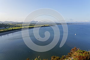 From Llanbedrog Headland across Cardigan Bay to a distant Abersoch on a cloudless summer evening