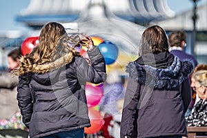 Llandudno , Wales - April 23 2018 : Folks enjoying the Pier at the seaside resort of Llandudno, North Wales, United