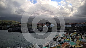 Llanes seaport with cliffs and lighthouse - 2 photo