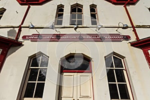 Sign on railway station building platform side for longest name Llanfairpwllgwyngyll, Anglesey, Wales photo