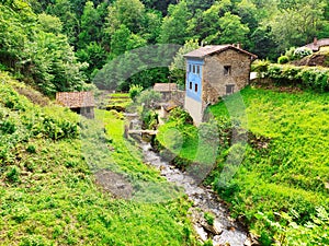 Llanxes river, natural border between Caso and PiloÃ±a municipalities, La Marea village, Asturias, Spain photo