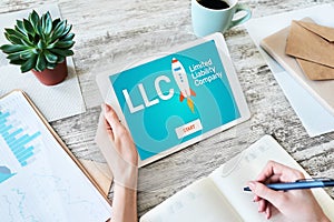 LLC Limited Liability Company. Business strategy and technology concept. photo