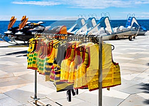 Llife jackets hanging on the beach. The concept of water safety